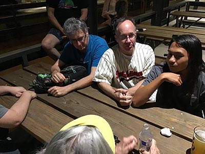 neighbors discussing movie the Creator at theater after seeing the film