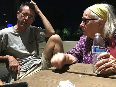 neighbors discussing movie the Creator at theater after seeing the film