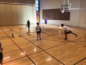 neighbors playing pickleball
