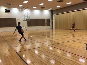 neighbors playing indoor soccer