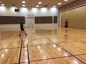 neighbors playing indoor soccer