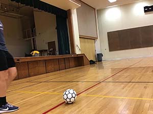 neighbors playing indoor soccer