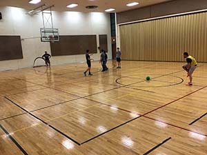 neighbors playing indoor soccer