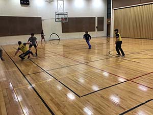 neighbors playing indoor soccer
