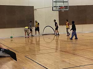 neighbors playing indoor soccer
