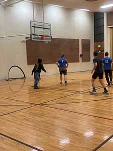 neighbors playing indoor soccer