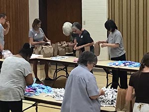 neighbors packing hygiene for homeless women and women in need