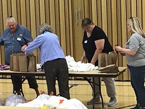 neighbors packing hygiene for homeless women and women in need