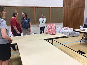 neighbors packing hygiene for homeless women and women in need