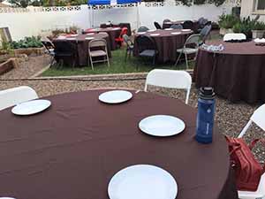 neighbors gather at for Thanksgiving Day potluck dinner