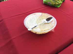 neighbors gather at for Thanksgiving Day potluck dinner
