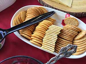neighbors gather at for Thanksgiving Day potluck dinner