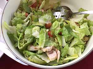 neighbors gather at for Thanksgiving Day potluck dinner