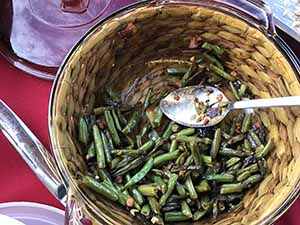 neighbors gather at for Thanksgiving Day potluck dinner