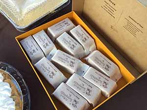 neighbors gather at for Thanksgiving Day potluck dinner