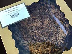 neighbors gather at for Thanksgiving Day potluck dinner