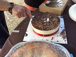 neighbors gather at for Thanksgiving Day potluck dinner