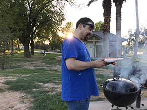 neighbors gather at park for potluck dinner birthday party