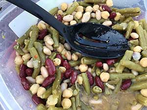 neighbors gather at park for potluck dinner birthday party