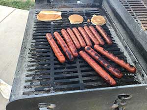 neighbors gather at park for potluck dinner birthday party