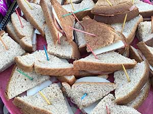 neighbors gather at park for potluck dinner birthday party