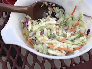 neighbors gather at park for potluck dinner birthday party