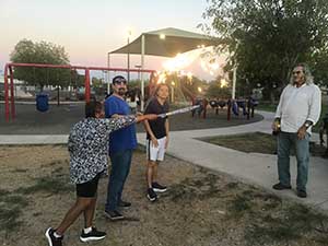 neighbors gather at park for potluck dinner birthday party