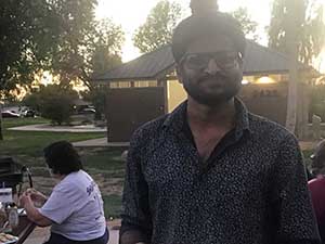 neighbors gather at park for potluck dinner birthday party