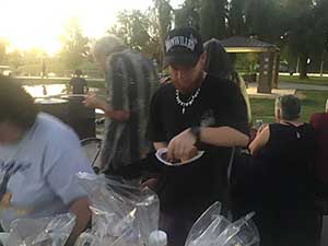 neighbors gather at park for potluck dinner birthday party