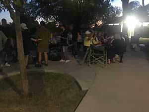 neighbors gather at park for potluck dinner birthday party