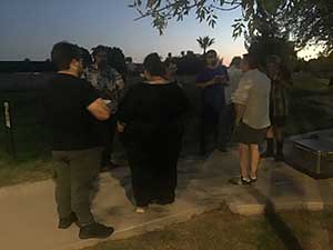 neighbors gather at park for potluck dinner birthday party