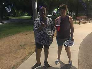 neighbors gather at park for potluck dinner birthday party