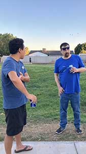 neighbors gather at park for potluck dinner birthday party