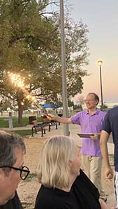 neighbors gather at park for potluck dinner birthday party