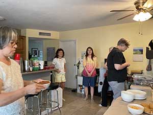 Tempe area neighbors gather at a watch party to watch the movie Hamnet
