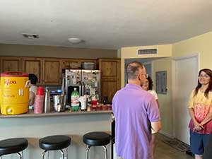 Tempe area neighbors gather at a watch party to watch the movie Hamnet