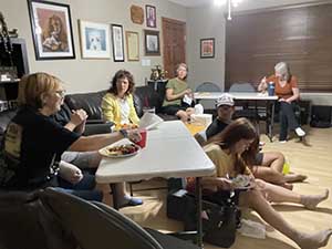 Tempe area neighbors gather at a watch party to watch the movie Hamnet