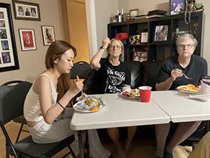 Tempe area neighbors gather at a watch party to watch the movie Hamnet