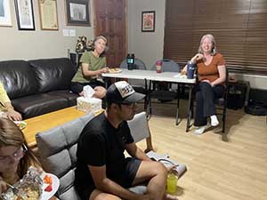 Tempe area neighbors gather at a watch party to watch the movie Hamnet