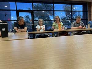 Tempe area neighbors at book club meeting in Tempe Public Library discussing the novel Hamnet