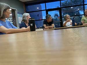 Tempe area neighbors at book club meeting in Tempe Public Library discussing the novel Hamnet