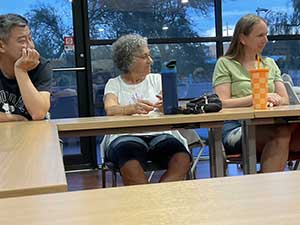 Tempe area neighbors at book club meeting in Tempe Public Library discussing the novel Hamnet