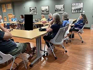 Tempe area neighbors at book club meeting in Tempe Public Library discussing the novel Hamnet