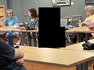 Tempe area neighbors at book club meeting in Tempe Public Library discussing the novel Hamnet