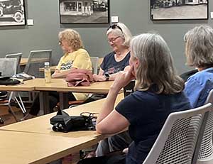 Tempe area neighbors at book club meeting in Tempe Public Library discussing the novel Hamnet