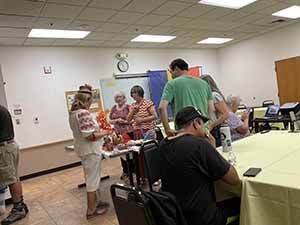 Tempe area neighbors at potluck dinner celebrating Romania
