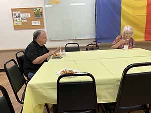 Tempe area neighbors at potluck dinner celebrating Romania