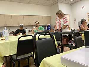Tempe area neighbors at potluck dinner celebrating Romania
