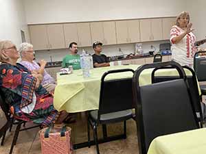 Tempe area neighbors at potluck dinner celebrating Romania